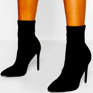 Pointed stiletto sock boots in black